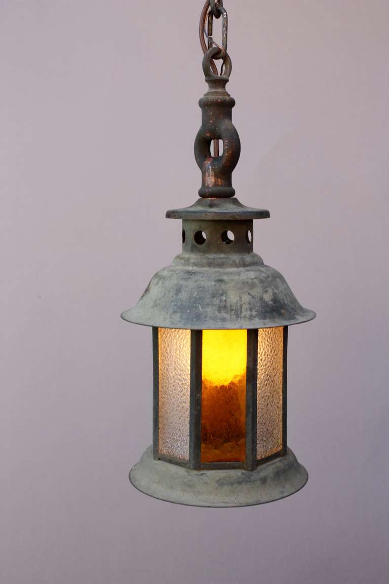 Circa 1920's pendant made of copper and with original stained glass. The body of the fixture measures 12.5