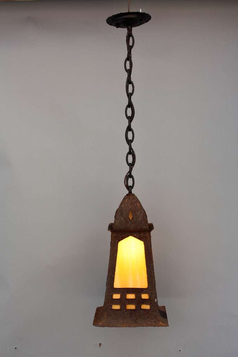 Circa 1920's, this lantern has its original rusty finish and slag glass inserts. measures approx. 8