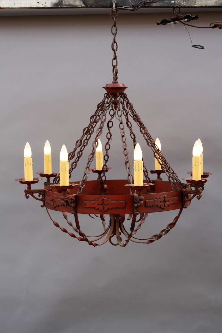 Original finish. Large scale eight candle chandelier. Circa 1930's. The fixture is 31