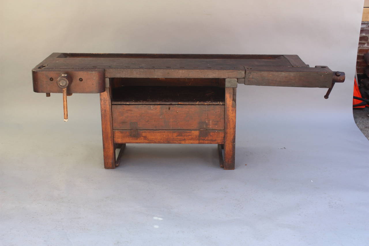 Circa 1900's work bench with original finish. Would make a great console table. Measures: 88