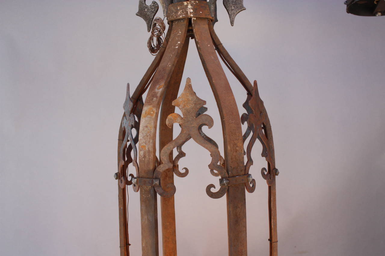 A rare find. Imposing wrought iron chandelier with 24 lights. Rustic finish. The body of the chandelier is 66