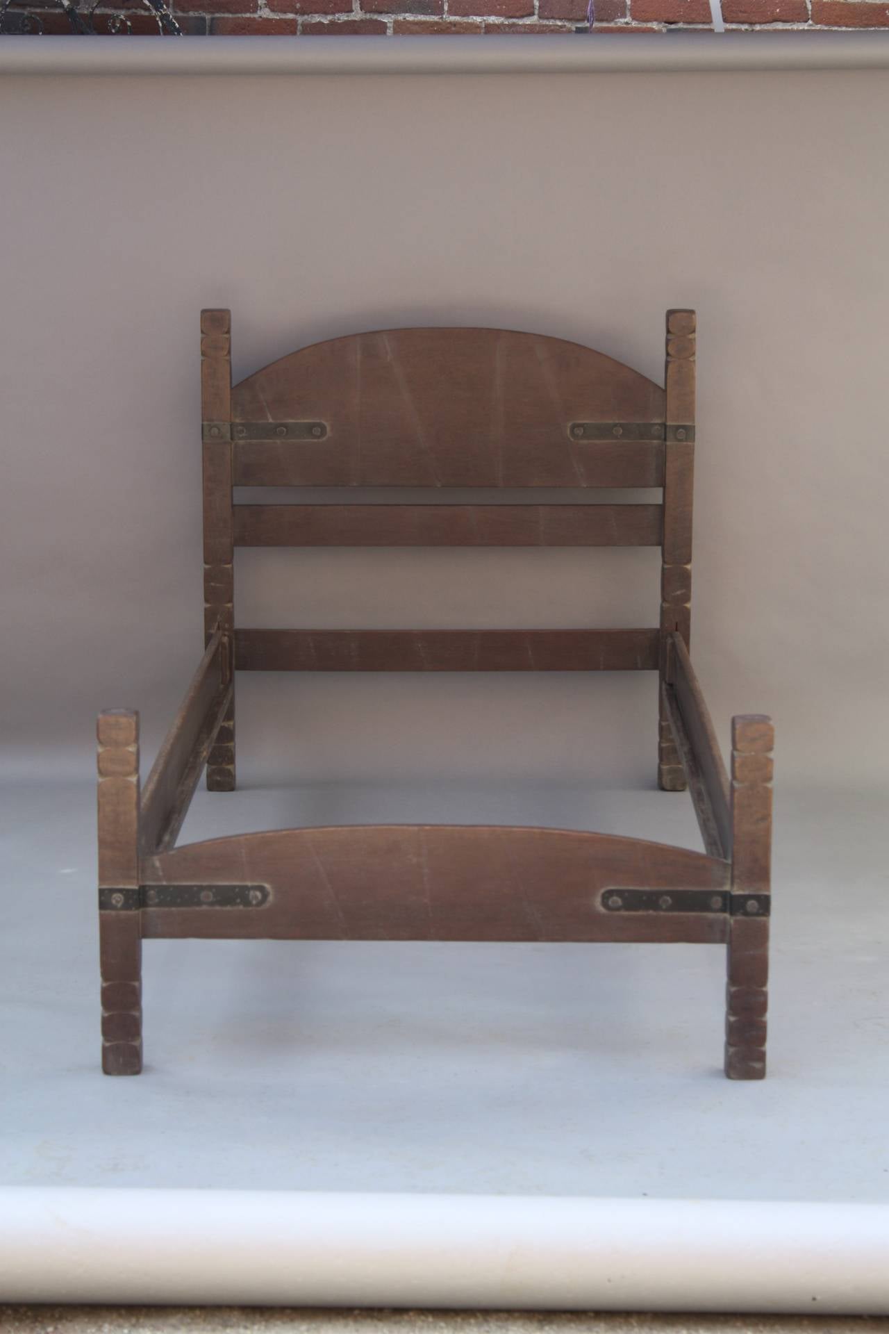 Circa 1930's pair of Rancho Monterey furniture twin beds. The finish is restored. 42.25