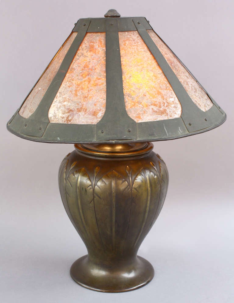 The bronze pass is Japanese pre-1910 and the shade is circa 1910. During the height of the arts and craft period it was not usual to see this type of marriage
between Japanese pass and hand made copper shades.  22.25