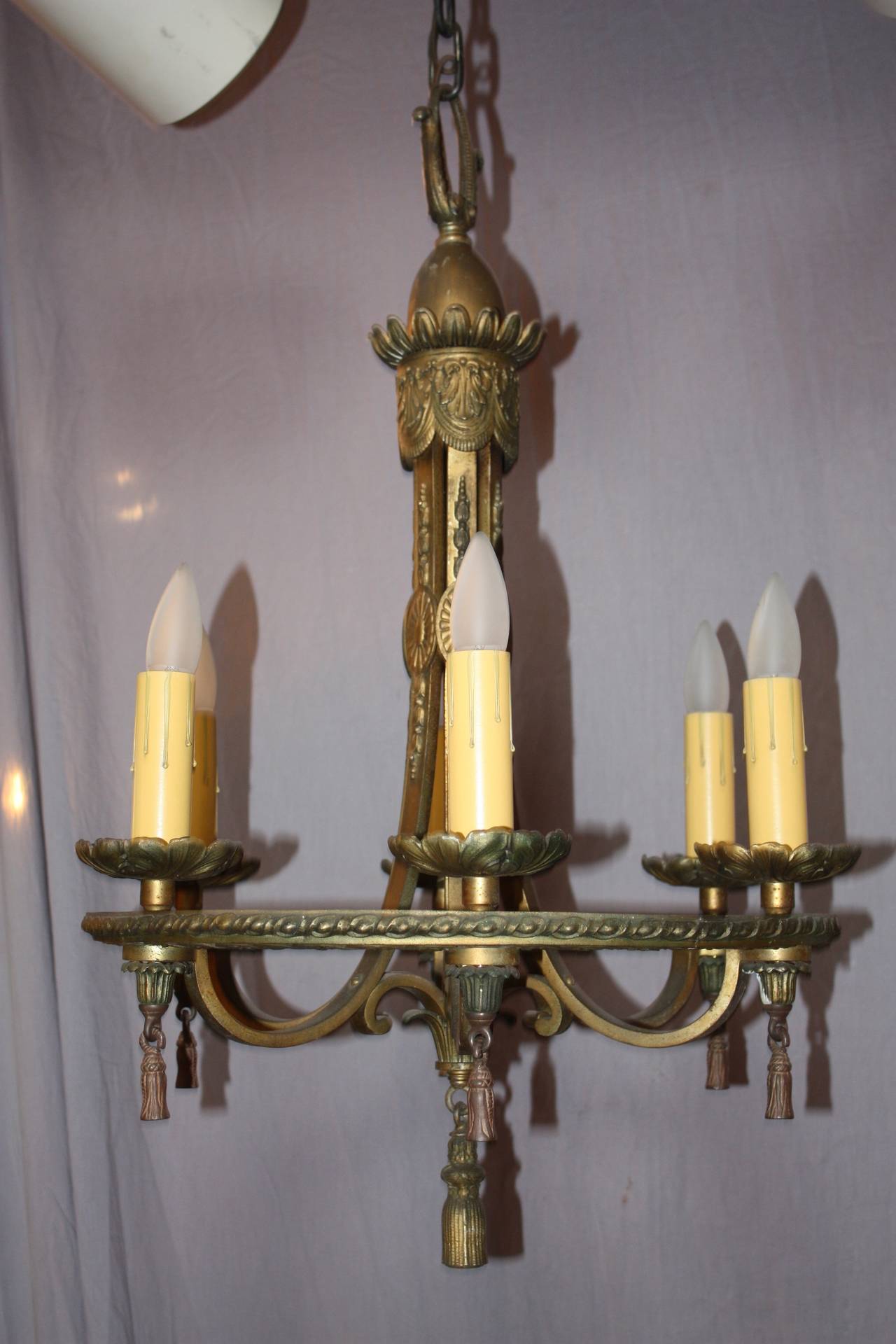 1920's period chandelier. Cast Brass. 20 W x 30 H (body of fixture) 45 H with chain and canopy.