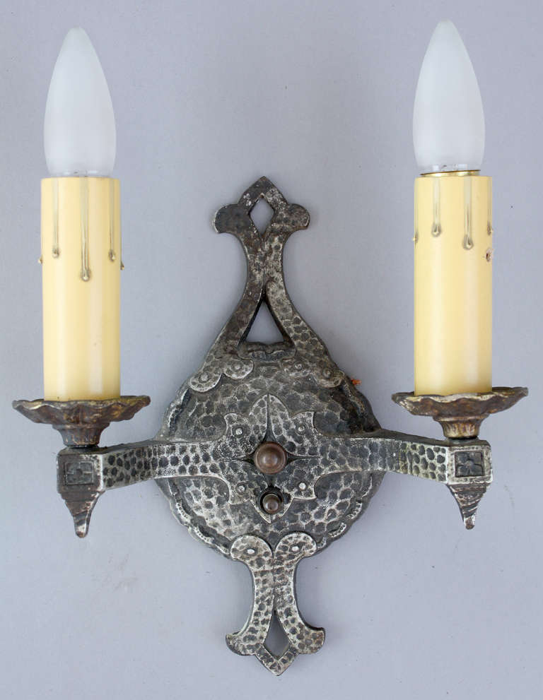 Circa 1920s cast iron sconce.  Can work with Tudor, Spanish Revival and arts and crafts interiors. Measures 9 5/8