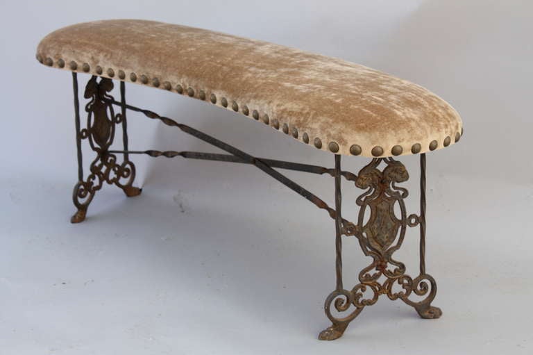 Classic 1920's curved bench with cast iron base. Newly upholstered in rich velvet. Original finish.