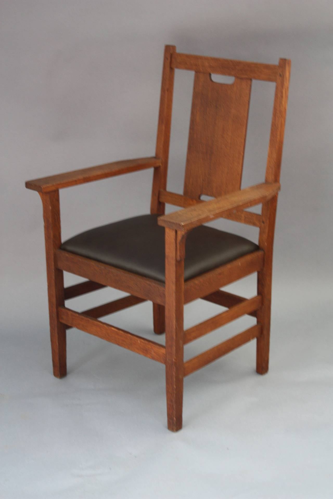 Circa 1910 armchair with new leather seat. Chair is not signed. Pegged. 39.5