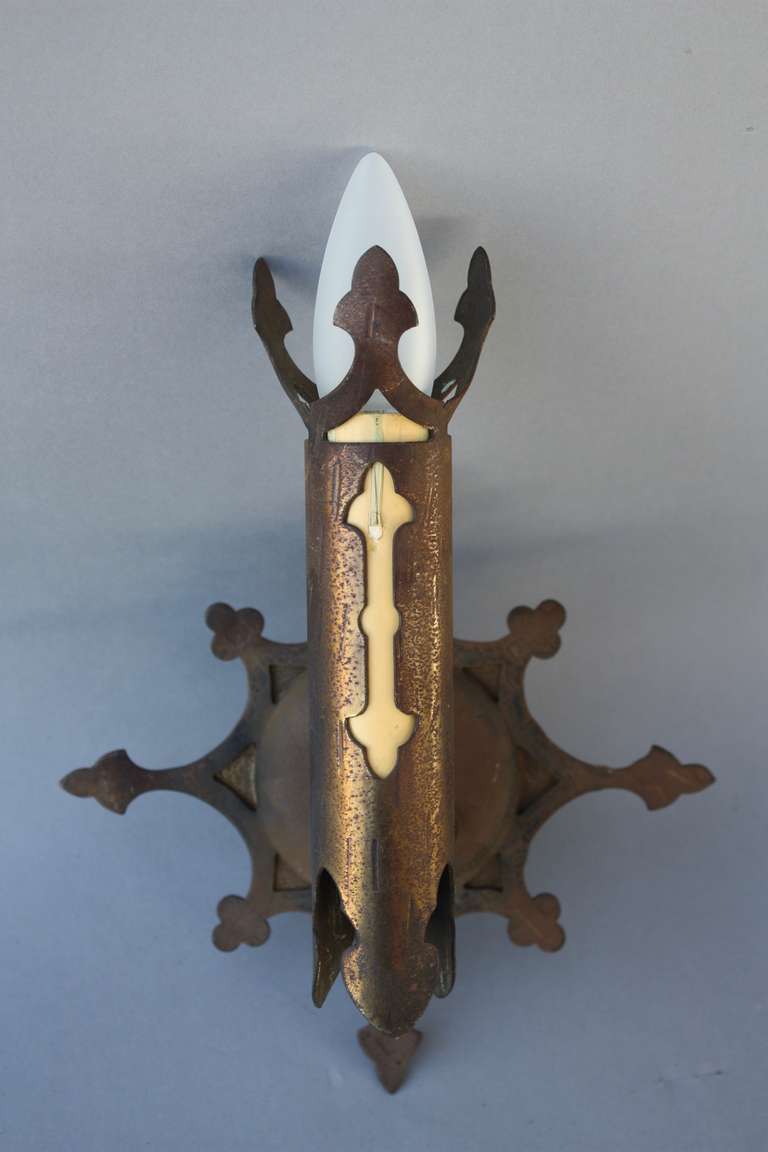 1920's sconces iron sconces with handsome star pattern. Measures 10 1/2