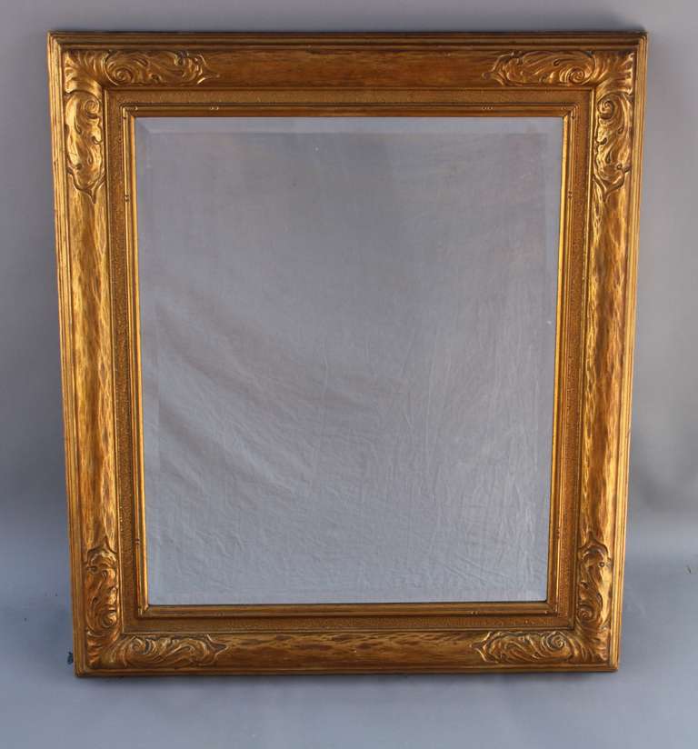 Circa 1920's frame. Beveled mirror is replaced. Measures 39