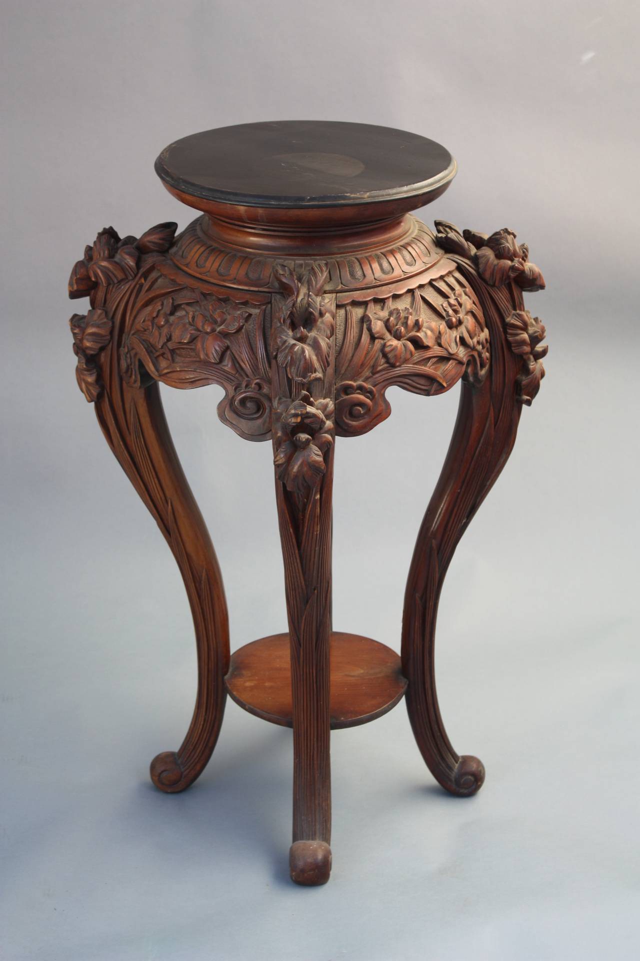 Ornately carved Chinese fern stand. Measures 35 1/4