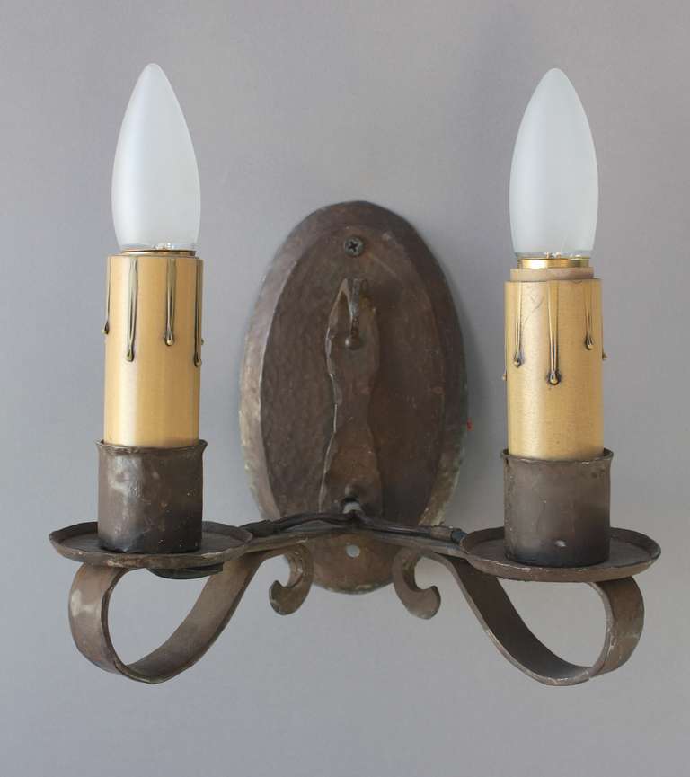 Sold individually. Circa 1920's wrought iron sconces with hammered textured. Simple and elegant - original finish. 7