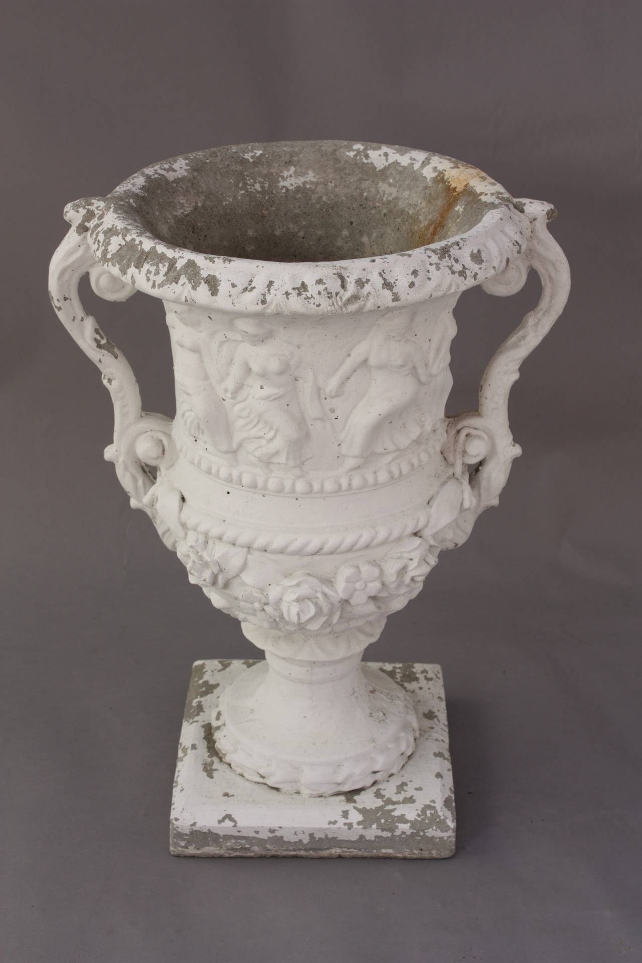 Painted cement urn with Grecian theme, circa 1930s. 25