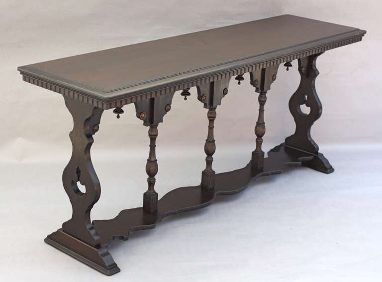 Shallow and long console table.  Stately design.