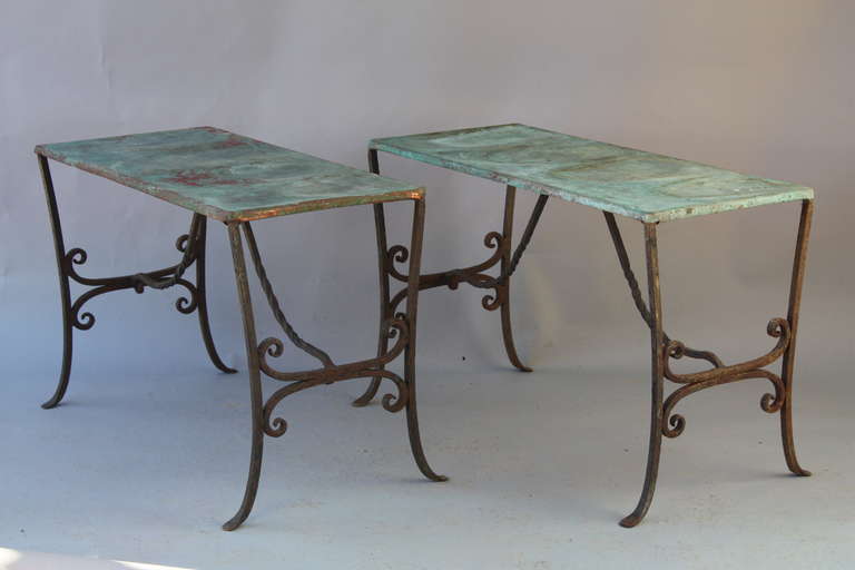 Circa 1920s wrought iron console with copper top. Old patina on top. Each console measures 29