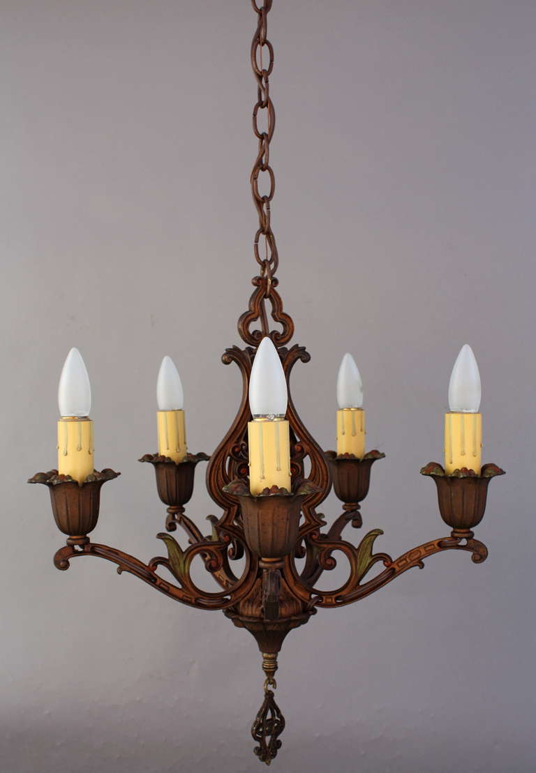 Elegant 1920s chandelier with all original polychrome finish. Body of fixture measures 20 1/2