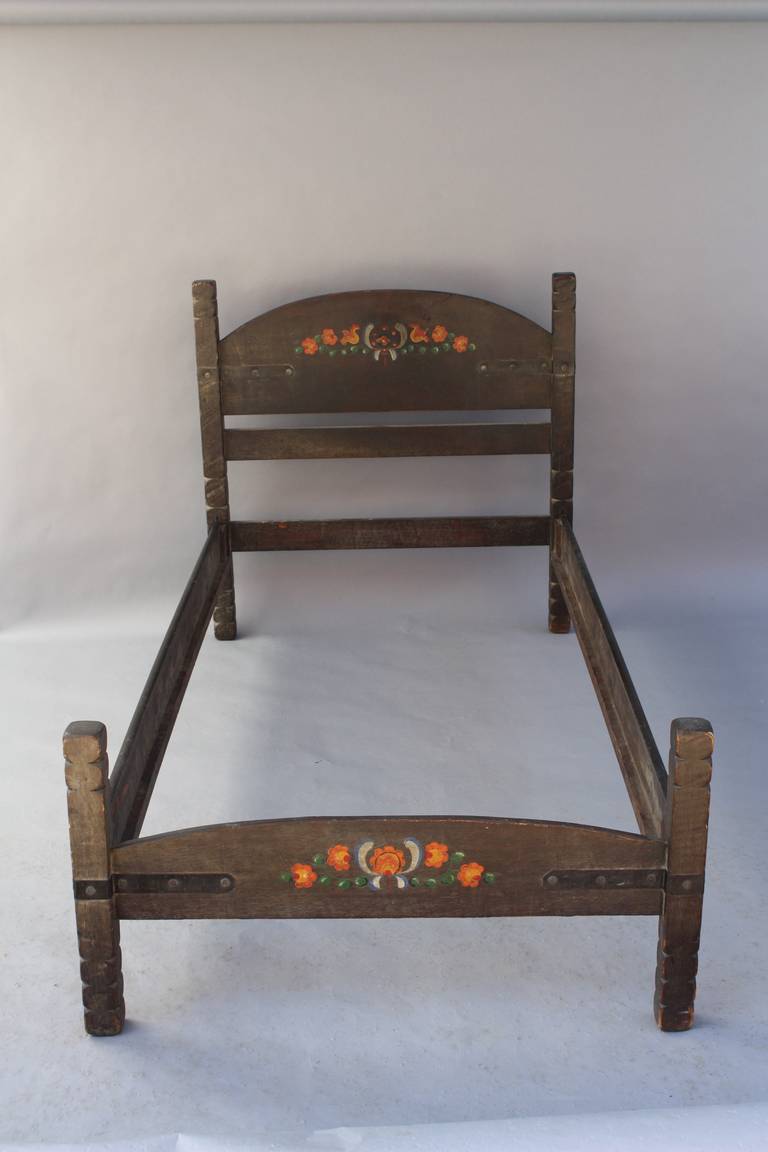 Monterey twin bed made by Barker Bros Cie in old world finish with hand painted floral design. Iron strapping. Branded. All original finish. Circa 1930's. 81.25
