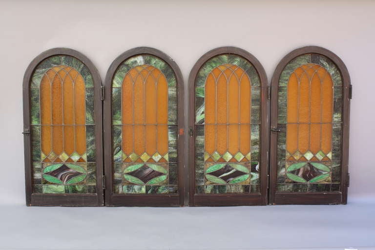 Priced and sold individually are these leaded art glass windows set with beautiful textured slag glass in shades of green, amber. and purple. Some minor damage/tight cracks.