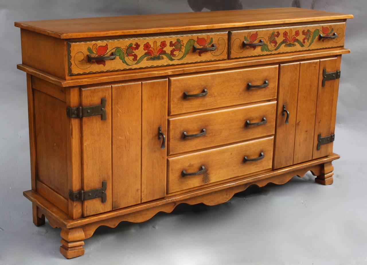 Nice large piece of Monterey made by Barker Bros. It has five drawers and two large cabinets for plenty of extra storage. Some wear on top please refer to photos. Heavy iron strapping and hardware. Hand-painted. Measure: 38.38
