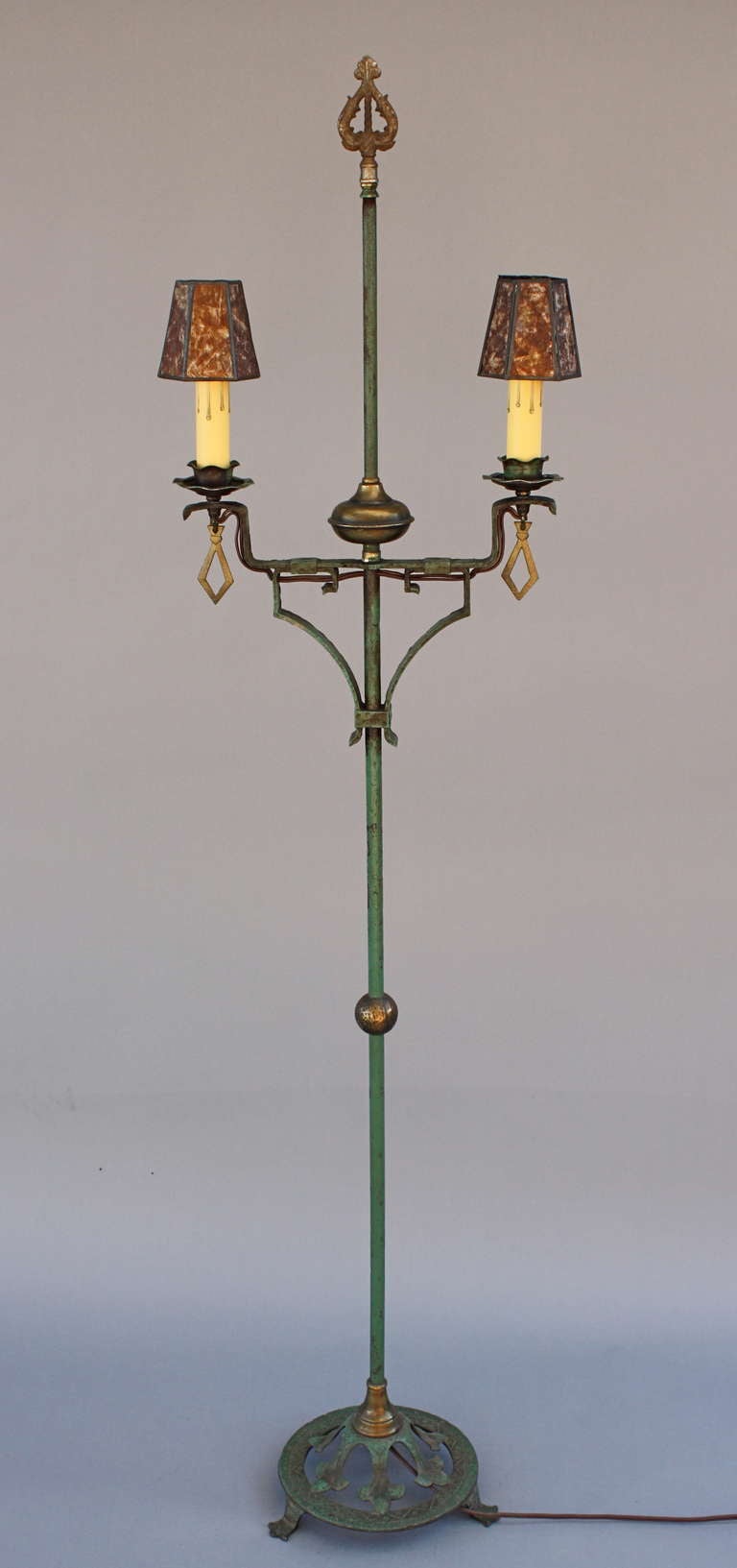 Beautiful 1920's floor lamp with original finish.  Features two contemporary mica clip-on shades.