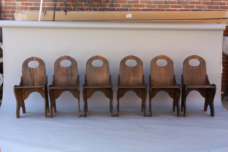 Signed and branded Monterey side chairs, circa 1930. All original dark Old finish with original iron strapping.