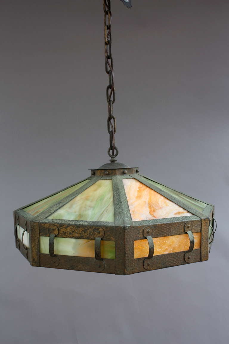 Circa 1910. Beautiful hammered texture with original slag glass.  The body of the fixture measures 10.25