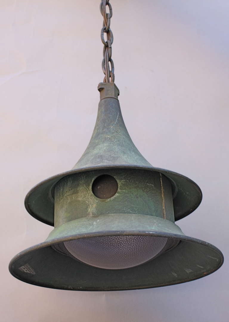 Circa 1940's industrial pendant. Glass and brass. Fixture itself is 15