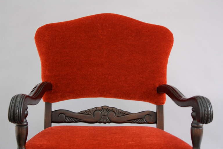 Circa 1920's carved armchair with new mohair upholstery.
