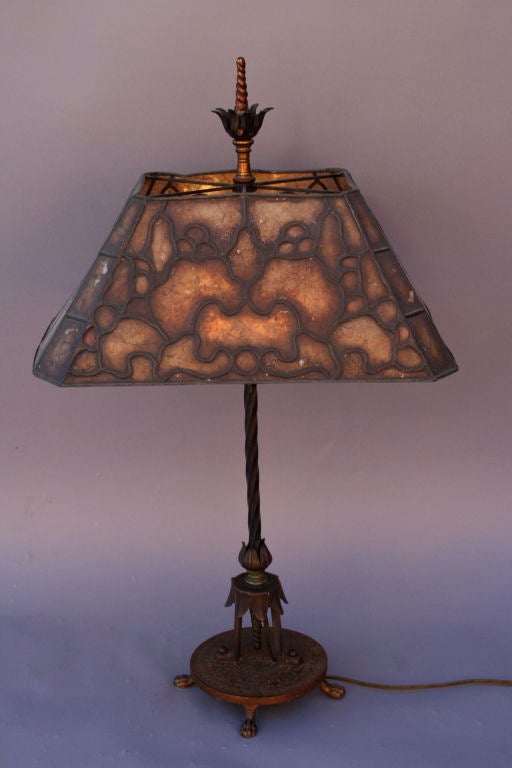 A beautiful example of 1920's craftsmanship with beautiful mica shade and intricately detailed base.