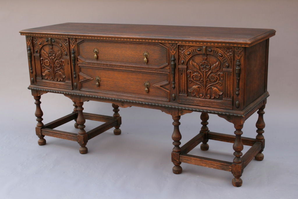 Beautiful example of Spanish Revival American Craftsmanship. Carved oak and inlaid details.