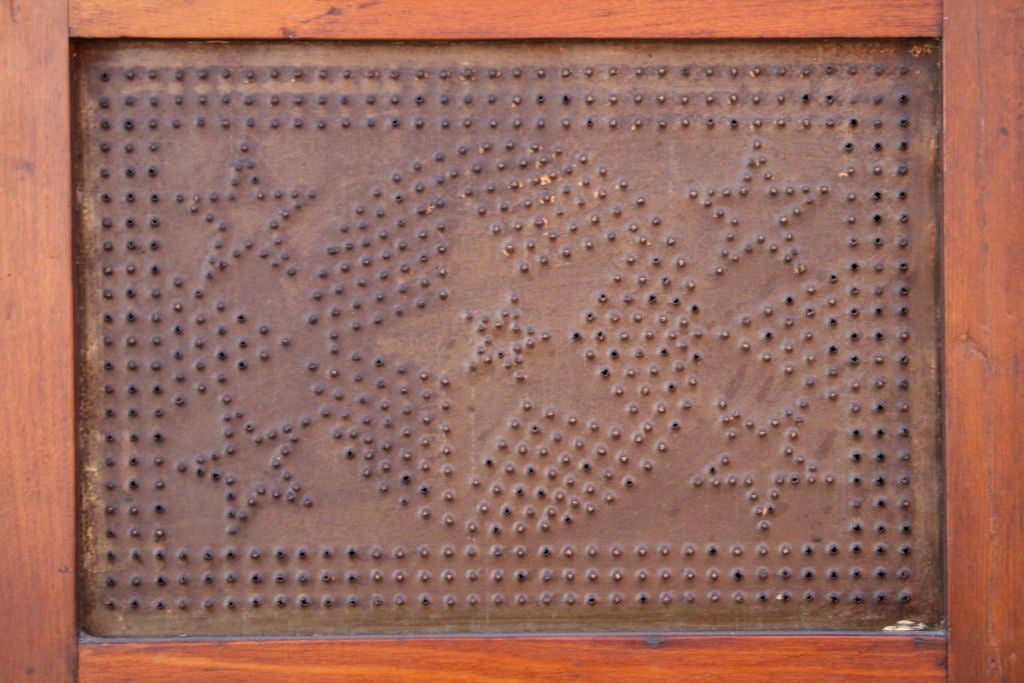 Classic antique American pierced tin pie safe.