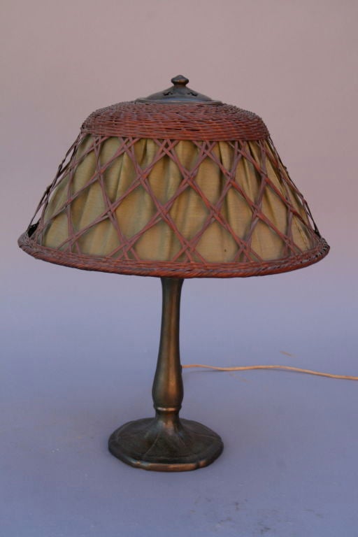 Classic Handel lamp base with a beautiful, handmade wicker shade with original liner.