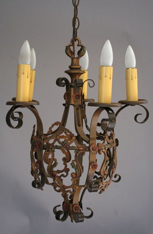 Lovely 5-light chandelier retains the original subtle polychrome finish over the swags, scrolls, and florets of its cast metalwork

c. 1920's - '30's; measures approx. 17 1/2