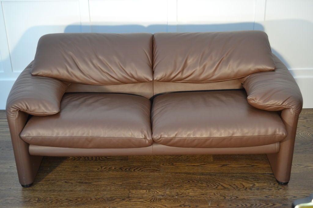 The Maralunga sofa was introduced in 1973 and became an instant classic. This two seat version was purchased in 2003 and is covered in leather. Note the back cushion on each side may be raised to form a headrest. It is amazingly comfortable.