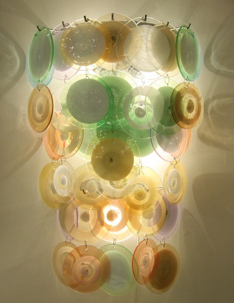 A pair of large Vistosi multi color discs wall lights, blown glass discs shades on steel structure. Made in Italy Murano ca.1960s
5 lights
wired for both Europe and USA