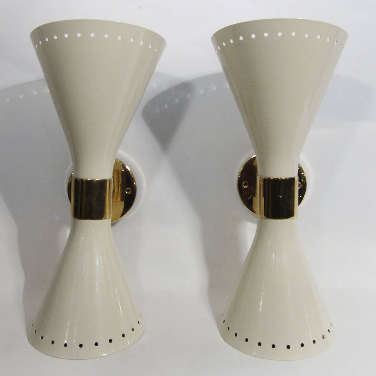 White enameled shades on brass structure. Italian design late 20th century.