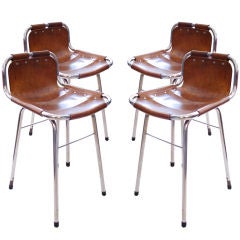 A set of four charlotte Perriand chairs/stool