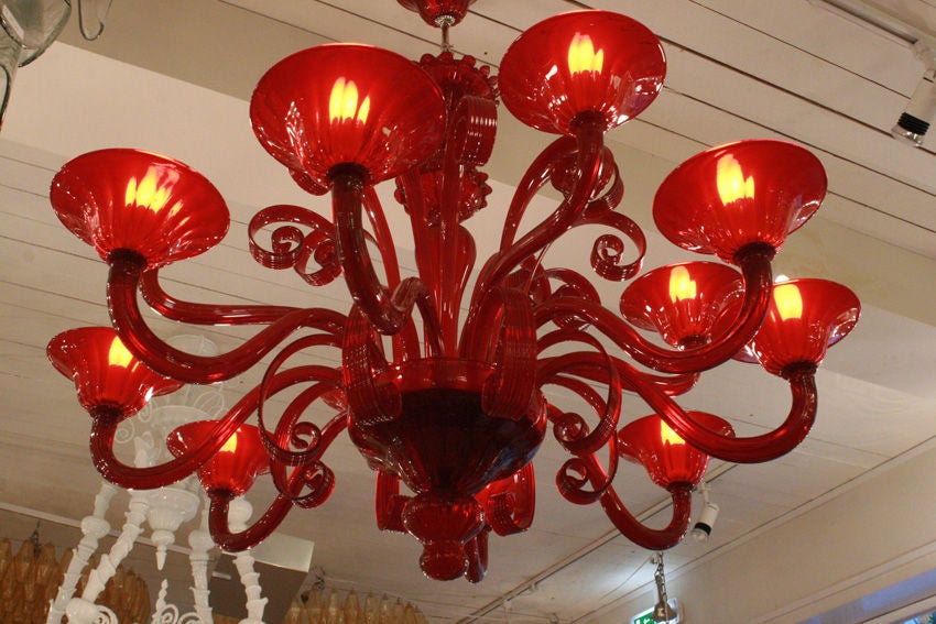 Ruby red Venetian 12 lighter chandelier.Blown Murano glass designed by Cenedese<br />
Made in Italy.