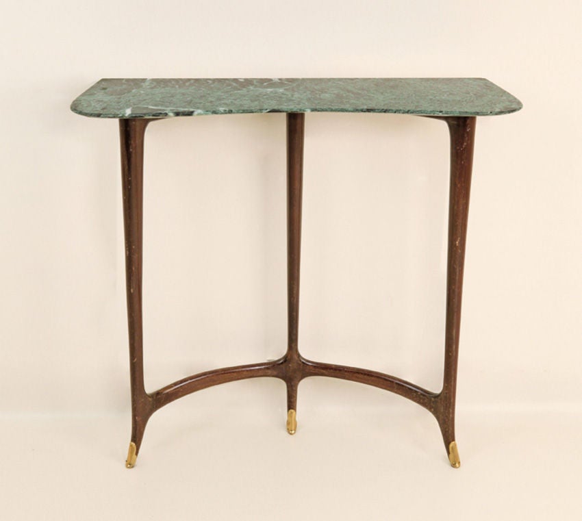 A console table, marble top, ebony  burnt wood frame,brass feet, designed by Guglielmo Ulrich  c.1940