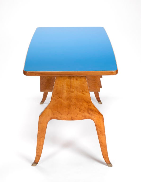A stunning desk, wallnut wood, blue glass top and three drawer. Italaian design ca.1950