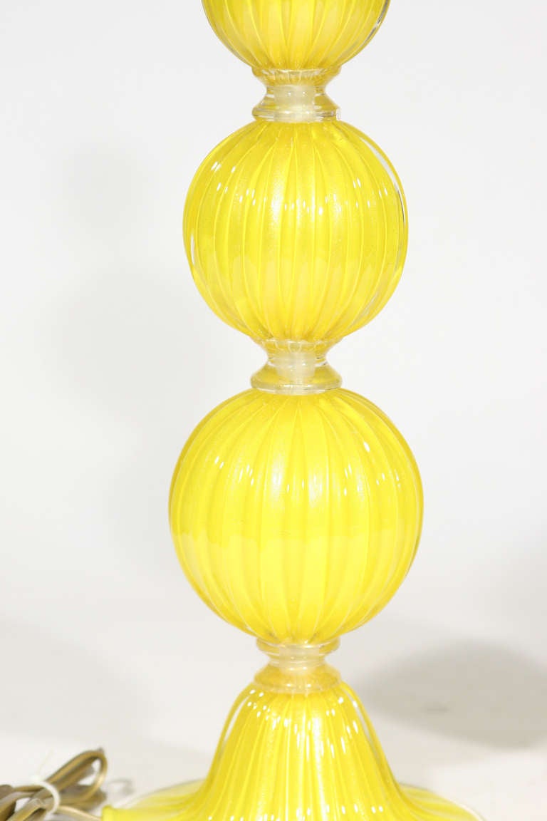 A pair of table lights ,yellow blown glass with gold inclusion. Made in Italy