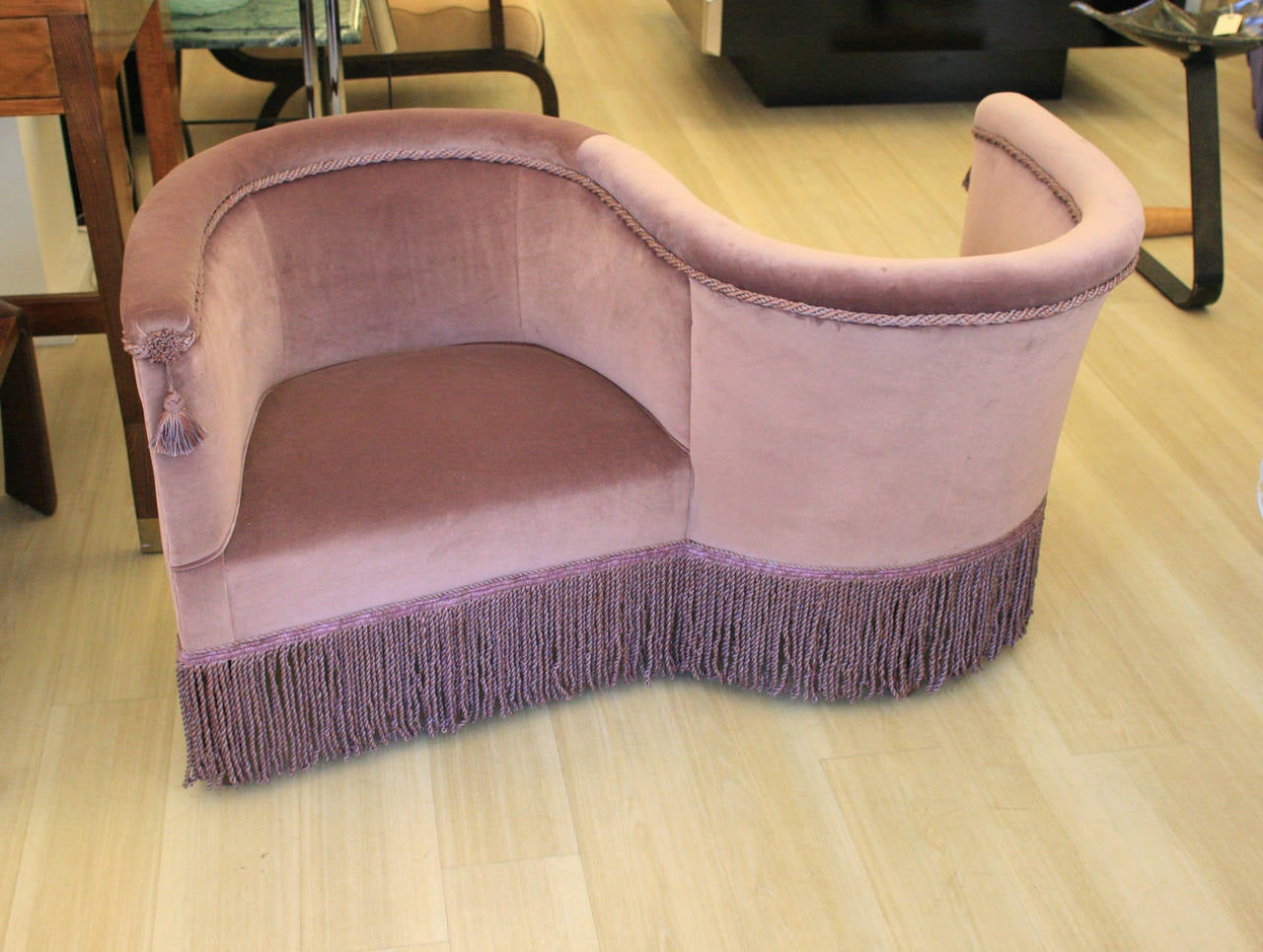 A two-seat loveseat 1940s Italian design attributed to Vincenzo Menegatti upholstered in pastel lilac velvet. Very rare piece.