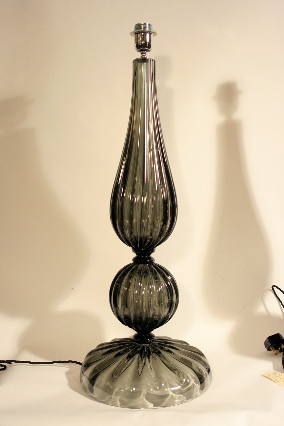 A pair of tall Murano blown glass table lights, smoked color blown glass. Made in Murano Italy. Signed by the artist.