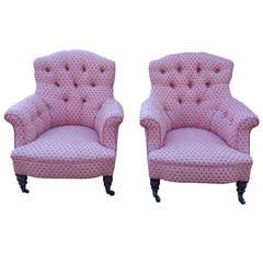 Pair of Howard and Sons button back armchairs 