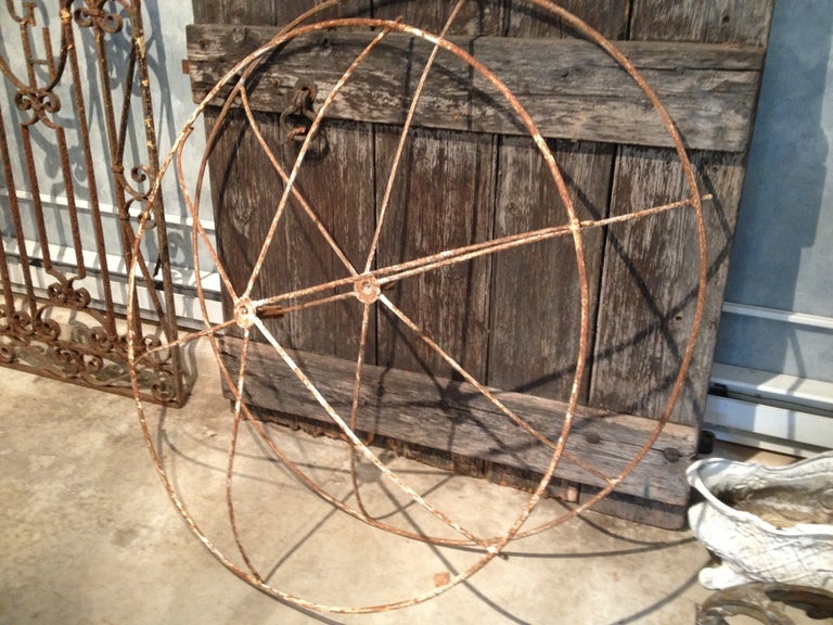 These wonderful and large rose trellises are all original and in crusty white paint with moderate surface rusting.  Originally, they would have been mounted on a center pole driven into the ground to form a proper 