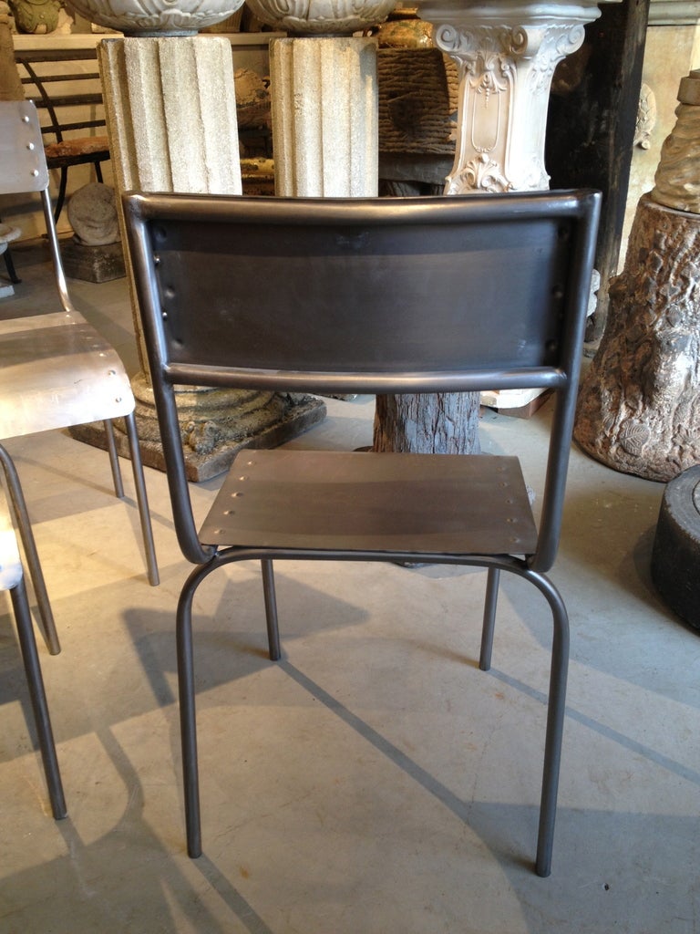 Set of Ten Riveted and Polished French Steel Chairs at 1stdibs