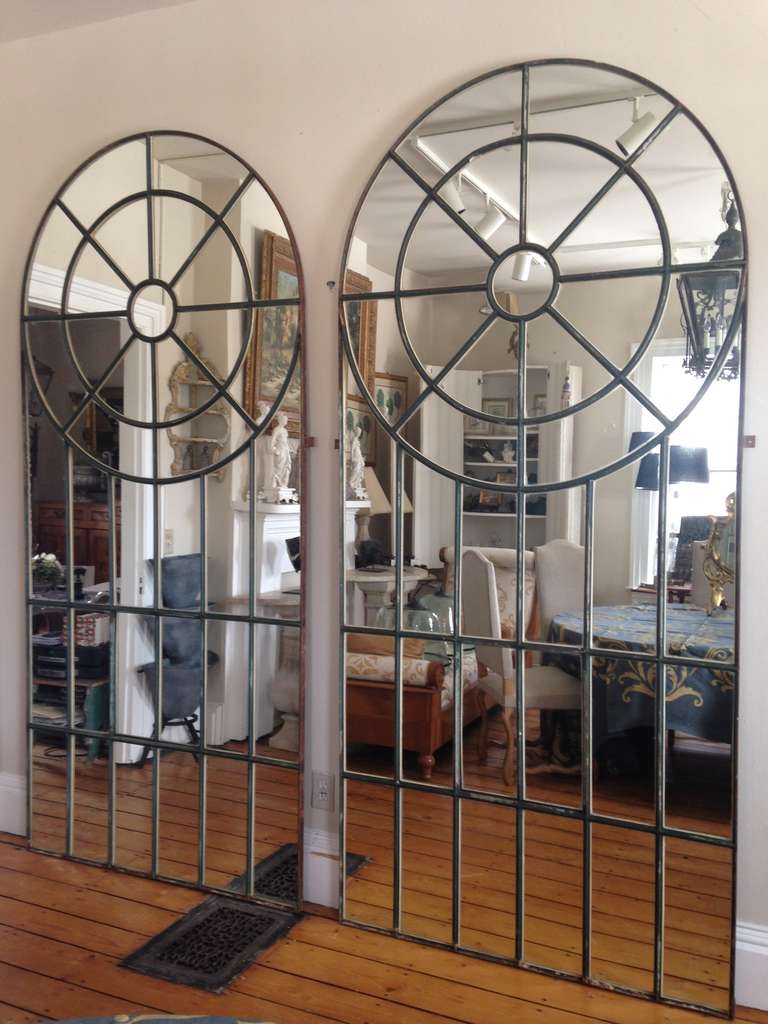 These spectacular cast iron windows once graced a 19th C English mill house.  Extremely rare of form, they would be magnificent indoors or out, at the end of a large living room or loggia, or leaning against a tall stone wall in the garden.  The