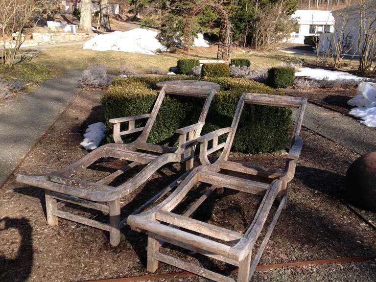 These chaises have a chic, streamlined form and read more like pieces of sculpture as opposed to mere furniture. Superbly comfortable, beautifully made of teak, and dating to the Art Deco period, they once sported caned seats and could do so again.