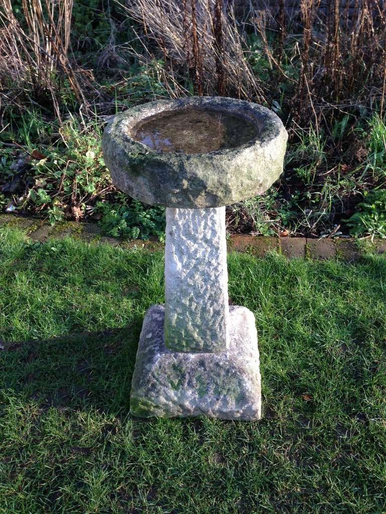 What a beauty...all hand-carved of a dense stone and with an unusual domed base.  It is beautifully weathered with a roomy bowl and will continue to green up when placed outside in a shady spot.  Easy to love in all climates as the top can just be