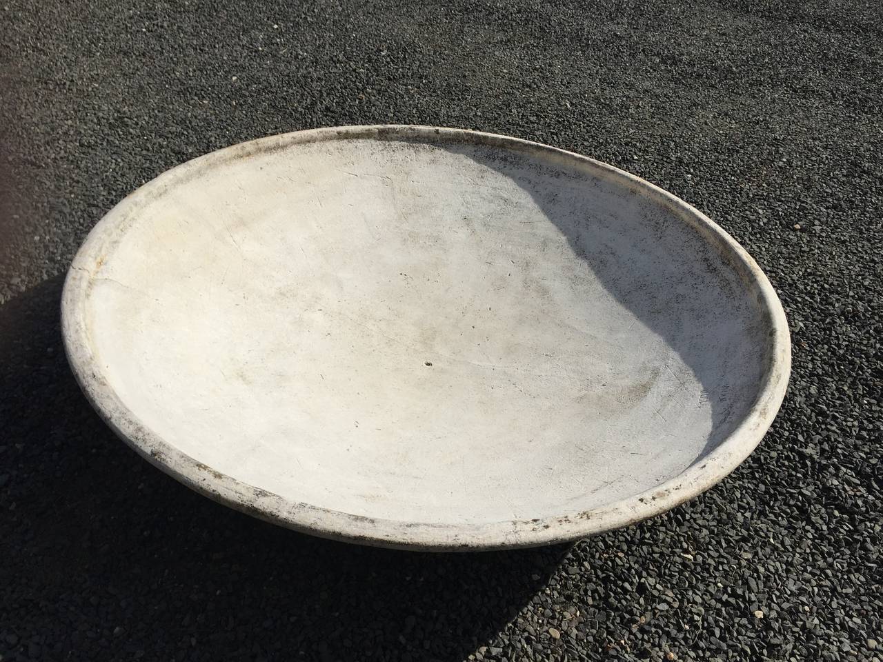 This rare saucer-form planter was designed by Willy Guhl for Eternit and produced, circa 1960. The largest Guhl model ever made, it is incised with production numbers, in original light-weathered surface, and is in excellent condition. Potted up