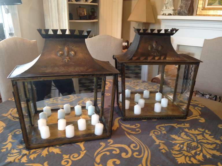 These vitrines are beautifully decorated with fleur-de-lys and leaf sprays and feature their original mirrored backs.  Each comes with a glass shelf (not shown) and can be rewired if you wish to display objects d'art, but we love them with candles